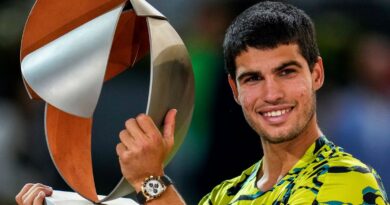 Carlos Alcaraz, of Spain, holds the winner's trophy after defeating Jan-Lennard Struff, of Germany, in the men's final at the Madrid Open