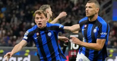 Inter Milan's Edin Dzeko, right, celebrates after scoring his side's opening goal during the Champions League semifinal first leg soccer match between AC Milan and Inter Milan at the San Siro stadium in Milan, Italy, Wednesday, May 10, 2023. (AP Photo/Antonio Calanni)