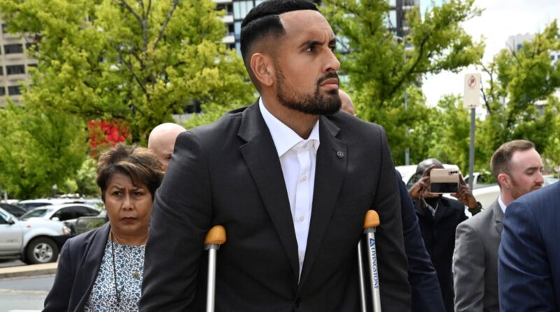 Australian tennis player Nick Kyrgios, center, arrives at the ACT Magistrates Court in Canberra, Friday, Feb. 3, 2023. Kyrgios has pleaded guilty in an Australian court to assaulting a former girlfriend during an argument in January 2021. (Mick Tsikas/AAP Image via AP)