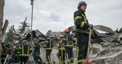 As rescuers sift through the rubble of a Kramatorsk restaurant, distraught relatives wait for news.