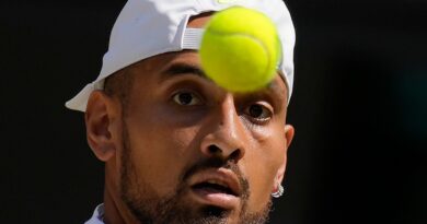 Australia's Nick Kyrgios returns to Serbia's Novak Djokovic in the final of the men's singles on day fourteen of the Wimbledon tennis championships in London, Sunday, July 10, 2022. (AP Photo/Kirsty Wigglesworth)