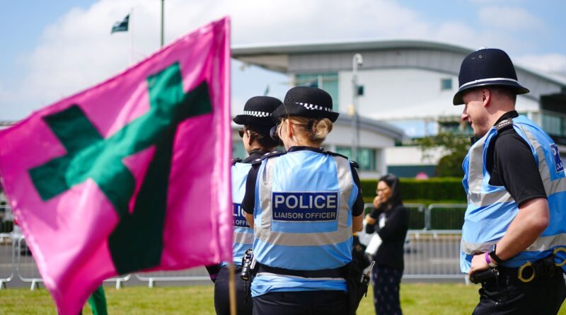 Police liaison officers monitor the situation at Epsom