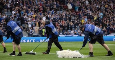 GLASGOW, SCOTLAND - JUNE 20: Pitch staff try to clear the water off the park during a UEFA Euro 2024 qualifier between Scotland and Georgia at Hampden Park, on June 20, 2023, in Glasgow, Scotland. (Photo by Alan Harvey / SNS Group)