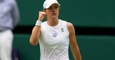 Poland's Iga Swiatek celebrates defeating Spain's Sara Sorribes Tormo during the women's singles match on day three of the Wimbledon tennis championships in London, Wednesday, July 5, 2023. (AP Photo/Alastair Grant)