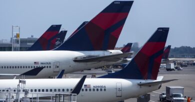 Delta lays off some corporate workers to cut costs